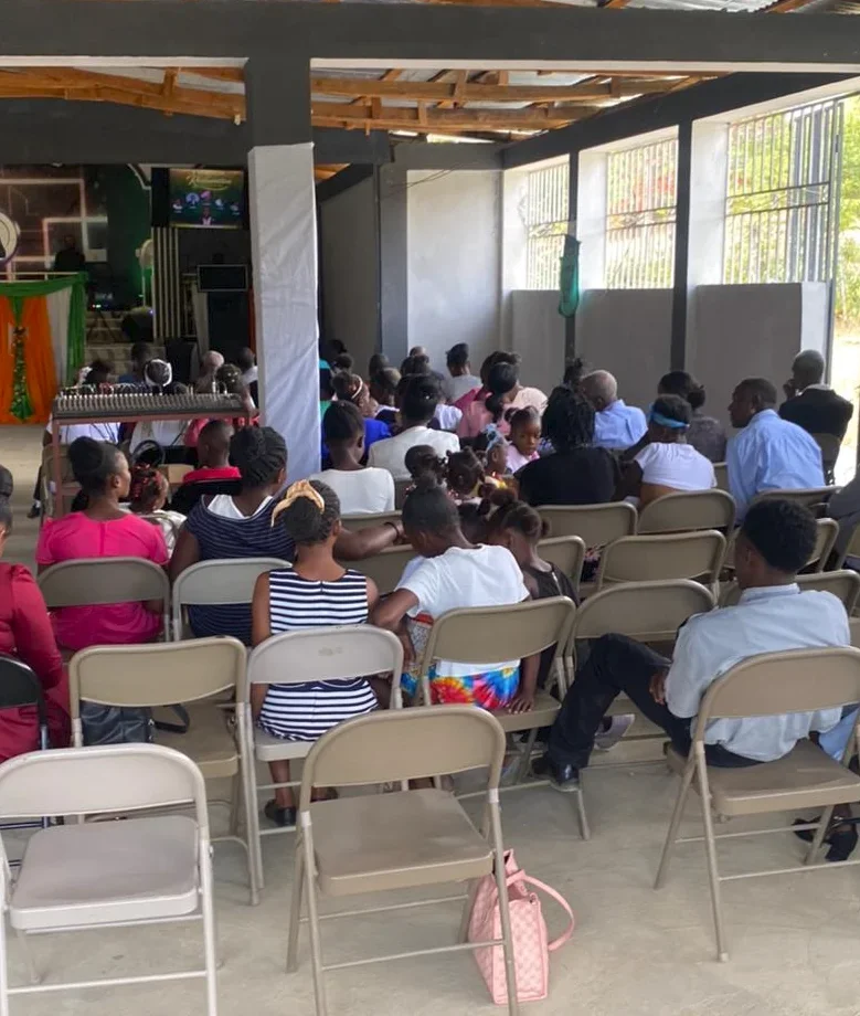 Children and families at church in Nan Pos, Haiti